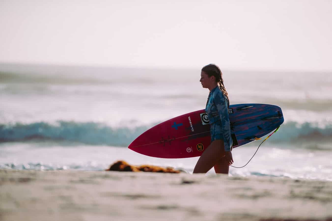 woman with surfboard leash