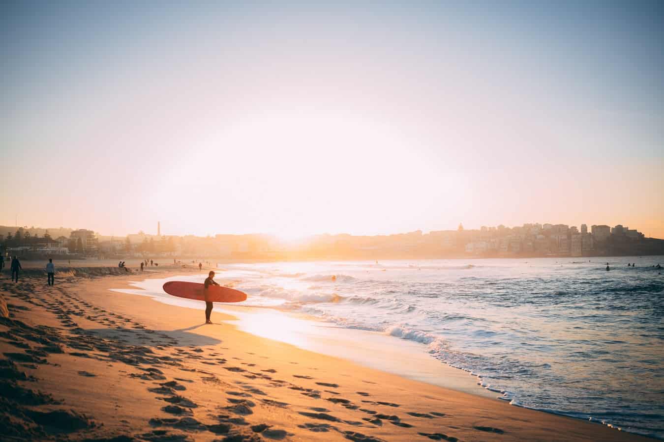 getting past the break on a longboard surfing